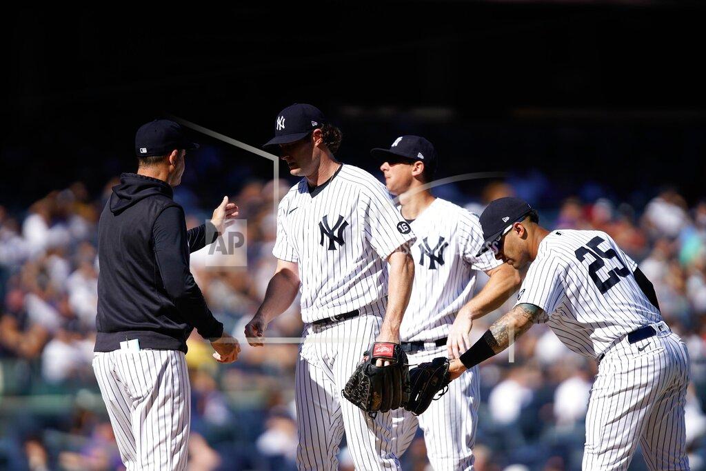 Eduardo Munoz Alvarez New York Yankees starting pitcher Gerrit Cole, center, is relieved in the sixth inning of a baseball game against the Cleveland Indians, Sunday, Sept. 19, 2021, in New York. (AP Photo/Eduardo Munoz Alvarez)