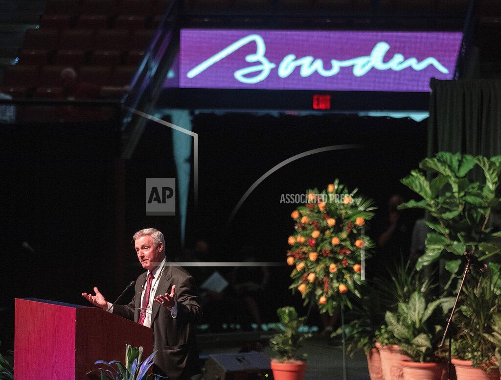 Mark Wallheiser Tommy Bowden, former head coach at Clemson, eulogizes his father, longtime Florida State football coach Bobby Bowden, as he lies in repose at the Tucker Civic Center during a public celebration of life, Saturday, Aug. 14, 2021, in Tallahassee, Fla. Bobby Bowden became the FSU football coach in 1976, transforming the program into one of the best in the country. He coached FSU to national championships in 1993 and 1999. Bowden was 91. (AP Photo/Mark Wallheiser)