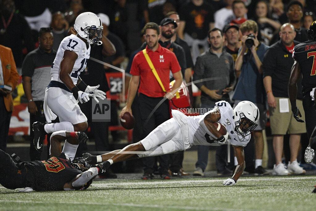 Nick Wass Penn State cornerback Tariq Castro-Fields (5) falls to the ground after intercepting a pass during the first half of an NCAA college football game against Maryland, Friday, Sept. 27, 2019, in College Park, Md. (AP Photo/Nick Wass)