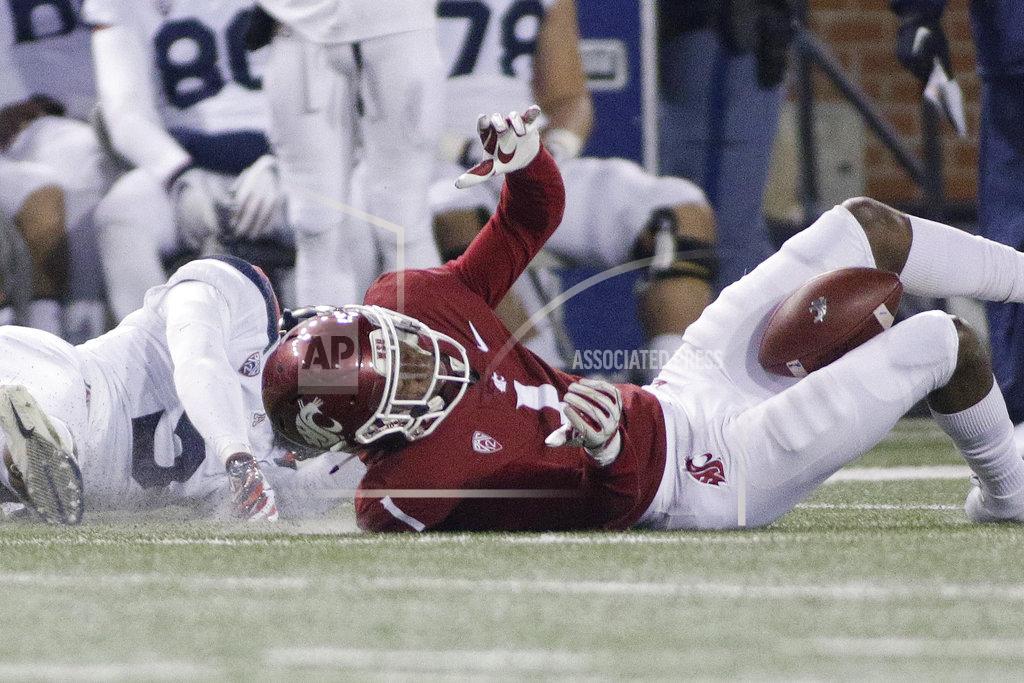 Young Kwak Washington State wide receiver Davontavean Martin (1) hangs on to a pass with his legs against Arizona safety Christian Young during the second half of an NCAA college football game in Pullman, Wash., Saturday, Nov. 17, 2018. Washington State won 69-28. (AP Photo/Young Kwak)