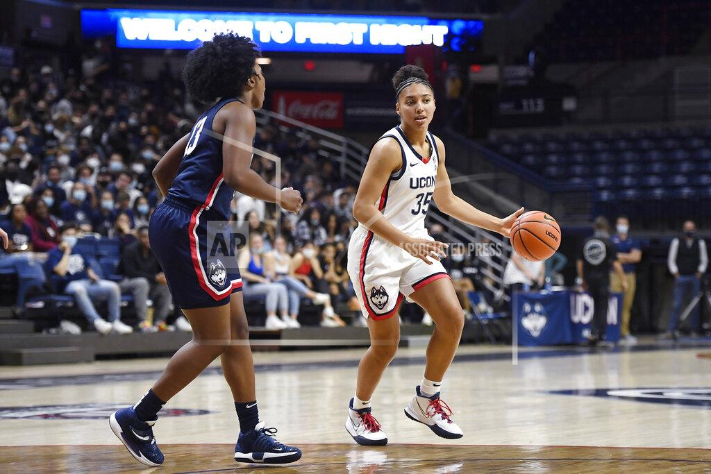 Jessica Hill Connecticut's Azzi Fudd dribbles as Christyn Williams, left, defends during First Night events for the UConn men's and women's NCAA college basketball teams Friday, Oct. 15, 2021, in Storrs, Conn. (AP Photo/Jessica Hill)