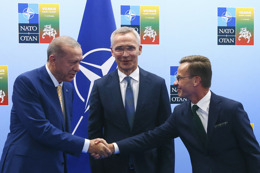 FILE - Turkey's President Recep Tayyip Erdogan, left, shakes hands with Sweden's Prime Minister Ulf Kristersson, right, as NATO Secretary General Jens Stoltenberg looks on prior to a meeting ahead of a NATO summit in Vilnius, Lithuania, Monday, July 10, 2023. The Turkish parliament&rsquo;s foreign affairs committee was poised on Tuesday, Dec. 26, 2023, to resume deliberations on Sweden&rsquo;s bid to join NATO, days after President Recep Tayyip Erdogan linked the Nordic country&rsquo;s admission on U.S. approval of Turkey&rsquo;s request to purchase F-16 fighter jets.(Yves Herman, Pool Photo via AP, File)
