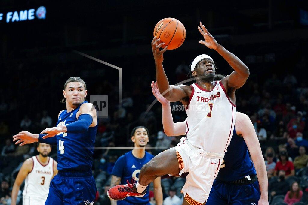 Ross D. Franklin Southern California forward Chevez Goodwin (1) drives to the basket after getting past Georgia Tech guard Jordan Usher (4) during the first half of an NCAA college basketball game at the Jerry Colangelo Classic Saturday, Dec. 18, 2021, in Phoenix. (AP Photo/Ross D. Franklin)