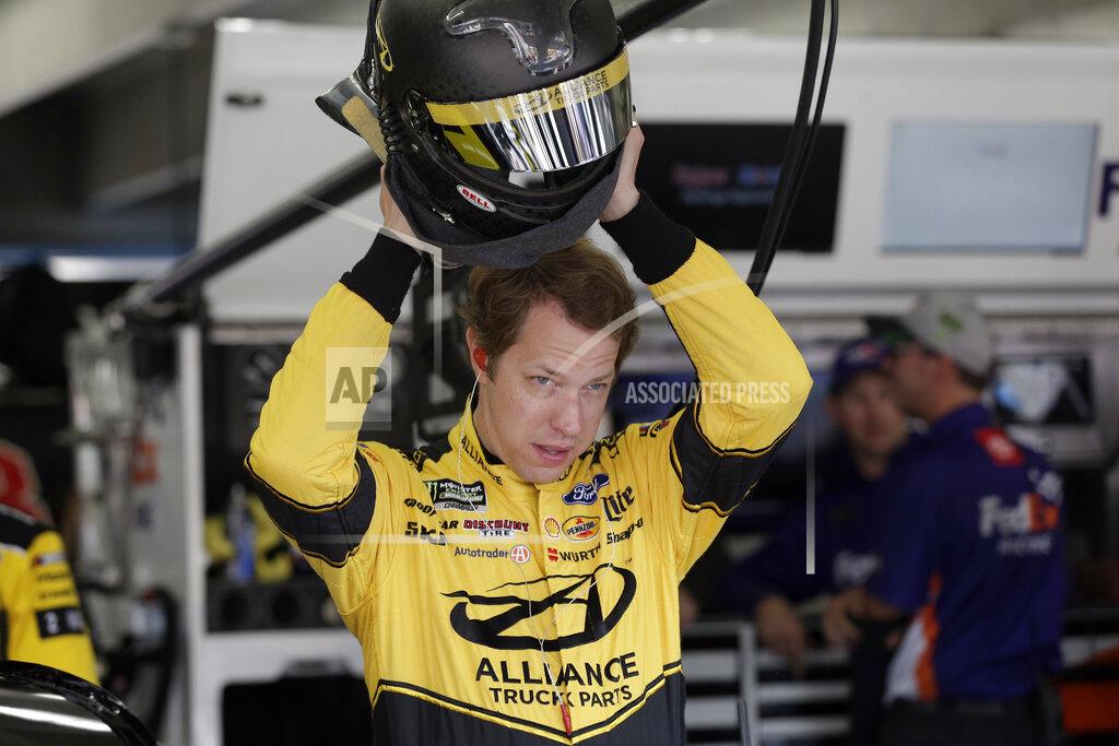 Gerry Broome FILE - In this Sept. 28, 2019, file photo Brad Keselowski puts on his helmet during practice for Sunday's NASCAR Cup Series auto race at Charlotte Motor Speedway in Concord, N.C. Keselowski won three races last year and made the playoffs, joining teammates Ryan Blaney and Joey Logano in a statistically strong season. (AP Photo/Gerry Broome, File)