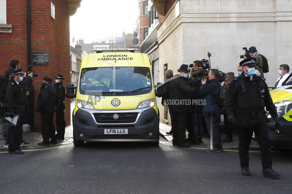Frank Augstein Police officers stand at an entrance to the King Edward VII Hospital where Prince Philip is being treated for an infection, as an ambulance is driven out, in London, Monday, March 1, 2021. (AP Photo/Frank Augstein)