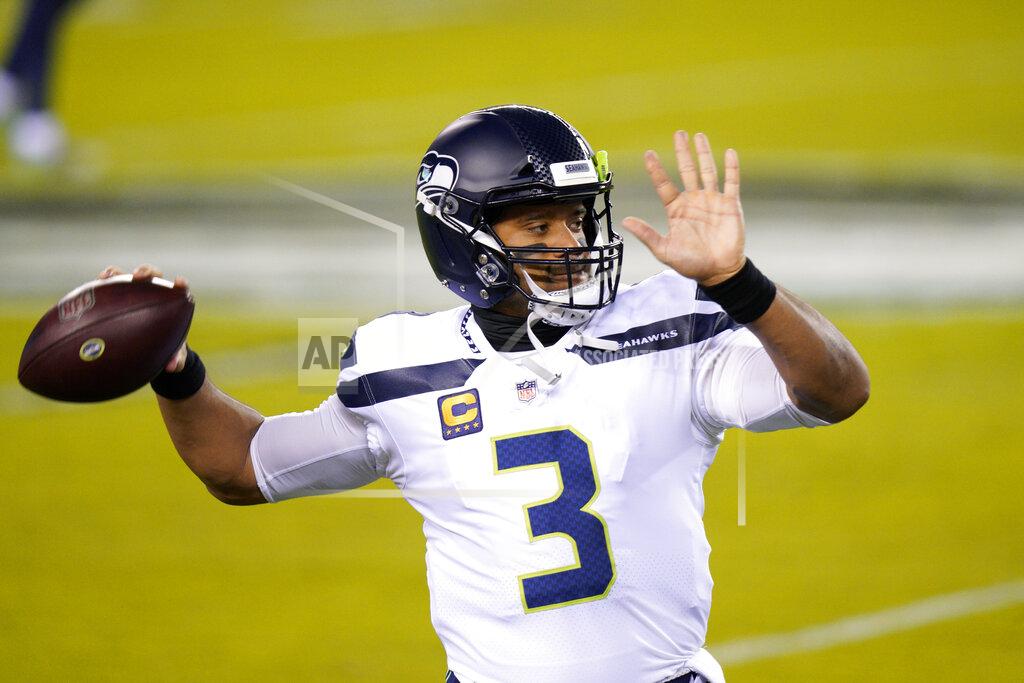 Chris Szagola Seattle Seahawks' Russell Wilson warms up before an NFL football game against the Philadelphia Eagles, Monday, Nov. 30, 2020, in Philadelphia. (AP Photo/Chris Szagola)