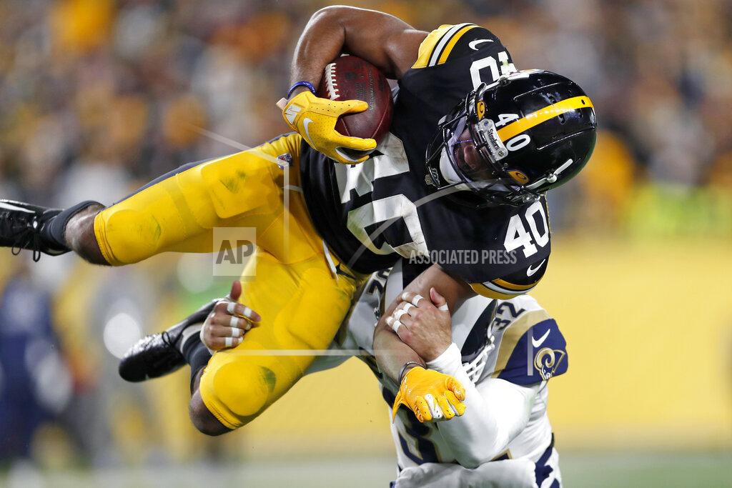 Keith Srakocic Los Angeles Rams free safety Eric Weddle (32) tackles Pittsburgh Steelers running back Tony Brooks-James (40) during the second half of an NFL football game in Pittsburgh, Sunday, Nov. 10, 2019. (AP Photo/Keith Srakocic)