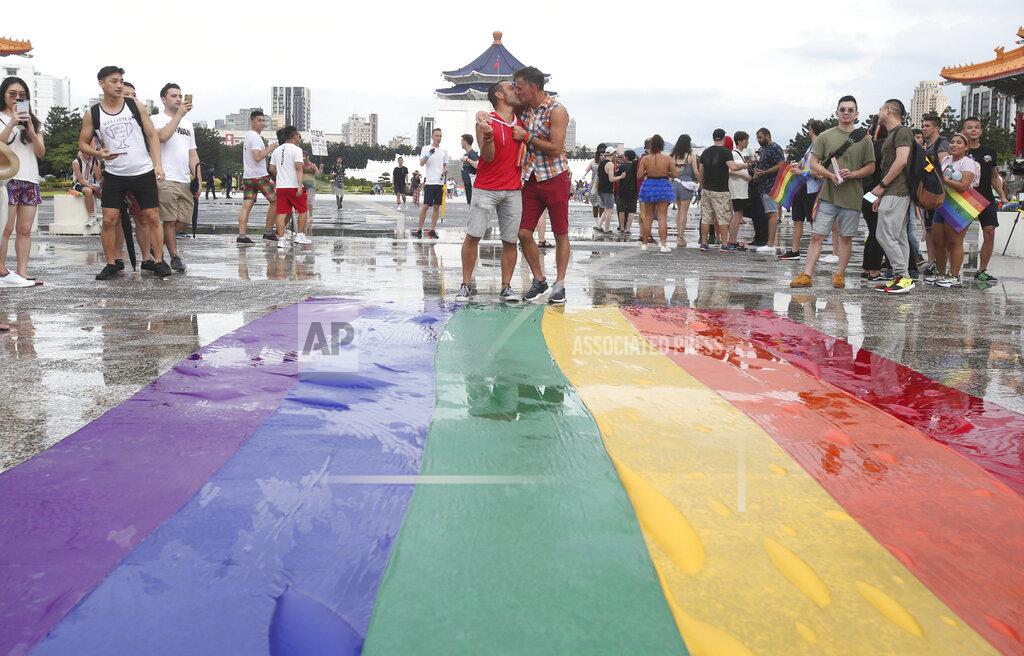 Chiang Ying-Ying Participants rally during the "Taiwan Pride March for the World!" at Liberty Square at the CKS Memorial Hall in Taipei, Taiwan, Sunday, June 28, 2020. This year marks the first Gay Pride march in Chicago 1970, and due to the COVID-19 lockdown, Taiwan is one of the very few countries to host the world's only physical Gay Pride. (AP Photo/Chiang Ying-ying)