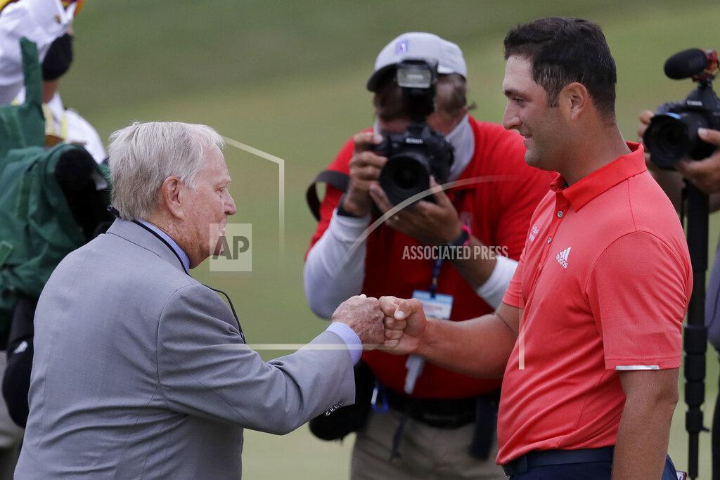 Darron Cummings Jon Rahm, of Spain, right, is congratulated by Jack Nicklaus after winning the Memorial golf tournament, Sunday, July 19, 2020, in Dublin, Ohio. (AP Photo/Darron Cummings)