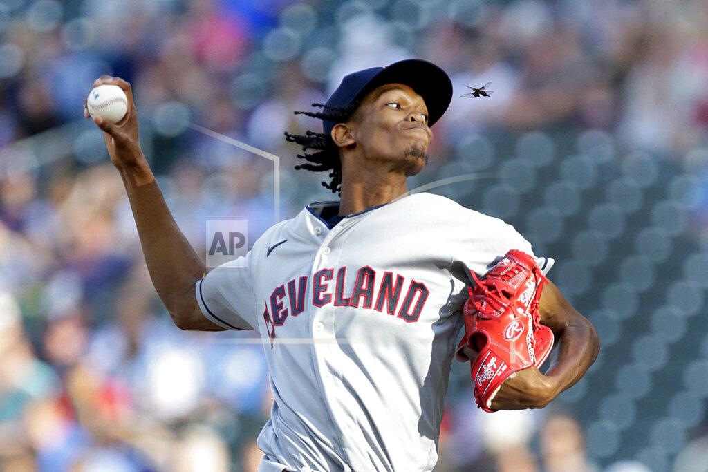 Andy Clayton-King An insect flies near Cleveland Guardians starting pitcher Triston McKenzie, who was pitching to a Minnesota Twins batter during the first inning of a baseball game Wednesday, June 22, 2022, in Minneapolis. (AP Photo/Andy Clayton-King)