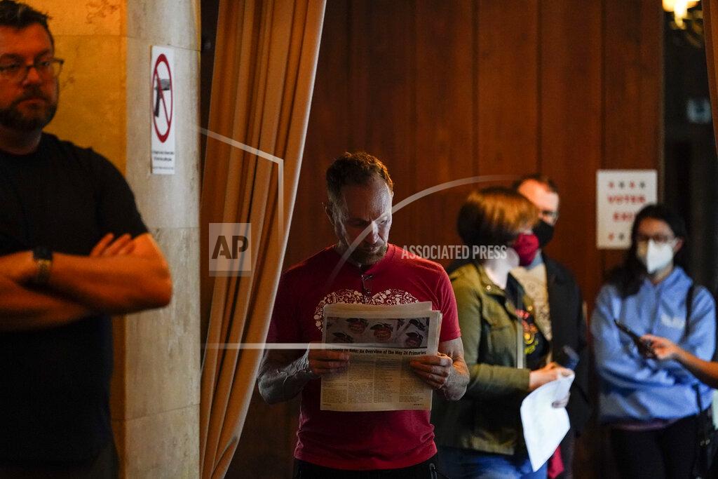 Brynn Anderson People wait in line to vote in the Georgia's primary election on Tuesday, May 24, 2022, in Atlanta. (AP Photo/Brynn Anderson)