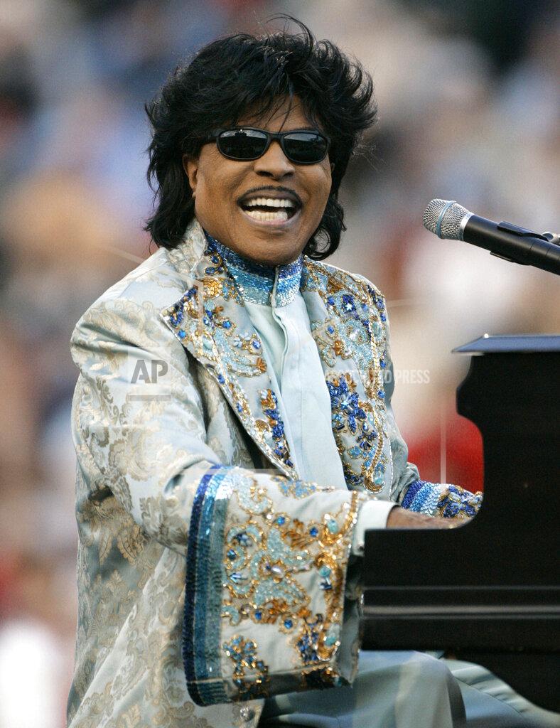 FILE - Little Richard performs during halftime at the Liberty Bowl in Memphis, Tenn. on Dec. 31, 2004. ESPN is changing their “Monday Night Football” theme song. The season will feature a new version of Little Richard's hit “Rip It Up,” featuring new instrumentals and backup vocals from the Virginia-based band Butcher Brown. Hank Williams Jr. had sung the theme song for years in a version of his hit “All My Rowdy Friends Are Coming Over Tonight." (AP Photo/Mark Humphrey, File)