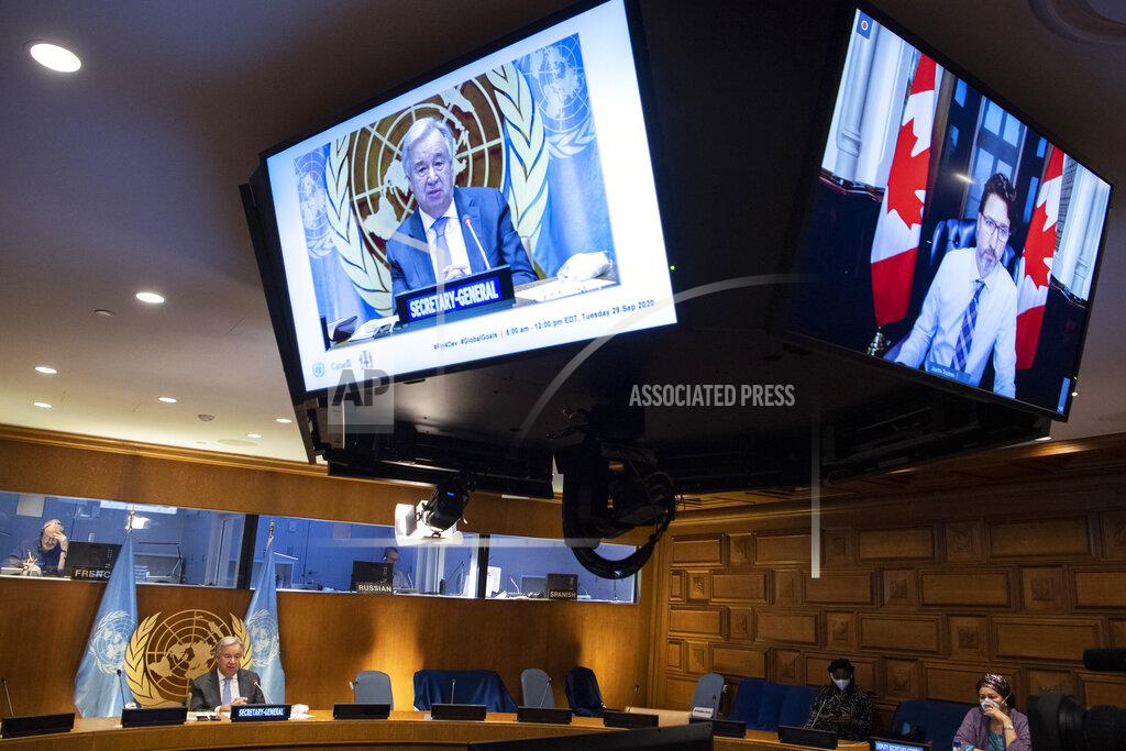 Eskinder Debebe In this photo provided by the United Nations, Secretary-General Antonio Guterres, on screen at left, addresses a meeting on financing the 2030 Agenda for Sustainable Development in the era of COVID-19 during the 75th session of the United Nations General Assembly, Tuesday, Sept. 29, 2020, at UN headquarters in New York. (Eskinder Debebe/UN Photo via AP)