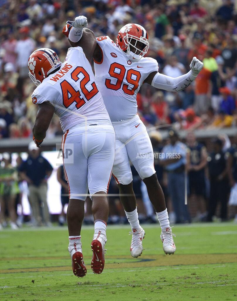 Jon Barash FILE - in this Sept. 22, 2018, file photo, Clemson defensive end Clelin Ferrell (99) and defensive lineman Christian Wilkins (42) celebrate a tackle against Georgia Tech during the first half of an NCAA college football game in Atlanta. Despite adding receiver Devin Funchess and linebacker Justin Houston in free agency, Indianapolis Colts general manager Chris Ballard could be seeking another young receiver to help quarterback Andrew Luck and another pass-rusher to pressure opponents. Some of the names being bandied about include Mississippi receiver A.J. Brown and three Clemson defensive linemen: Wilkins, Ferrell and Dexter Lawrence. (AP Photo/Jon Barash, File)