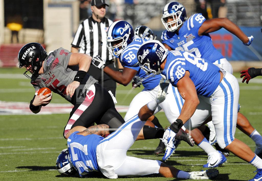 Rogelio V. Solis Temple quarterback Anthony Russo (15) is sacked by Duke safety Damani Neal (27) as others pursue in the second half of the Independence Bowl NCAA college football game in Shreveport, La., Thursday, Dec. 27, 2018. (AP Photo/Rogelio V. Solis)