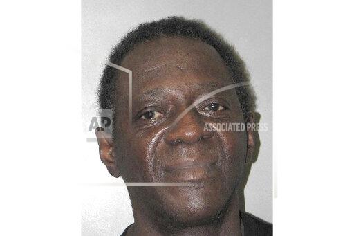 This Henderson Detention Center booking photo shows entertainer Flavor Flav following his arrest Oct. 4, 2021, in Henderson, Nev. Police and court documents said Tuesday, Oct. 19 the 62-year-old former hip-hop and reality TV star, whose legal name is William Jonathan Drayton Jr., faces a misdemeanor domestic battery charge stemming from a scuffle with his girlfriend at home. Drayton's lawyers say they'll explain his side of the story in court. (Henderson Police Department via AP)