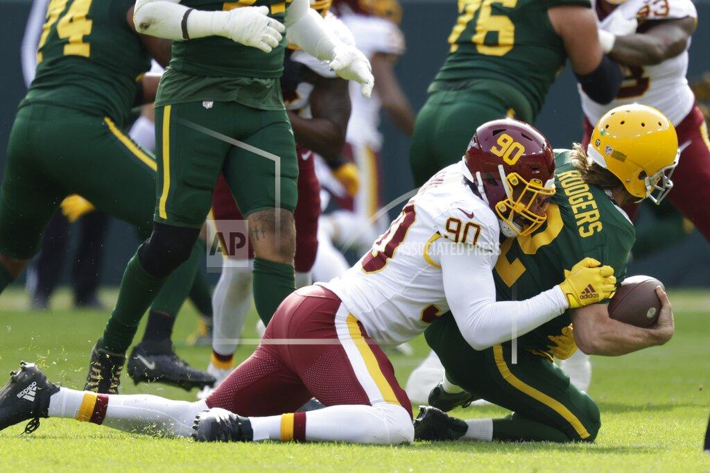 Matt Ludtke Washington Football Team's Montez Sweat sacks Green Bay Packers' Aaron Rodgers during the first half of an NFL football game Sunday, Oct. 24, 2021, in Green Bay, Wis. (AP Photo/Matt Ludtke)