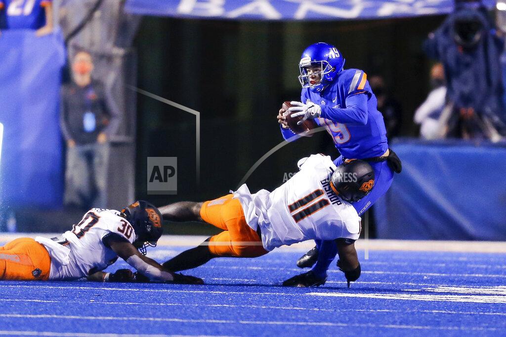 Steve Conner Boise State quarterback Hank Bachmeier (19) is sacked by Oklahoma State linebacker Lamont Bishop (11) during the second half of an NCAA college football game Saturday, Sept. 18, 2021, in Boise, Idaho. (AP Photo/Steve Conner)