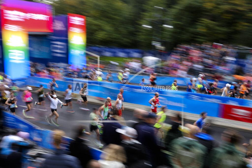Christoph Soeder Athletes run at the start of the Berlin Marathon in Berlin, Germany, Sunday, Sept. 25, 2022. (AP Photo/Christoph Soeder)