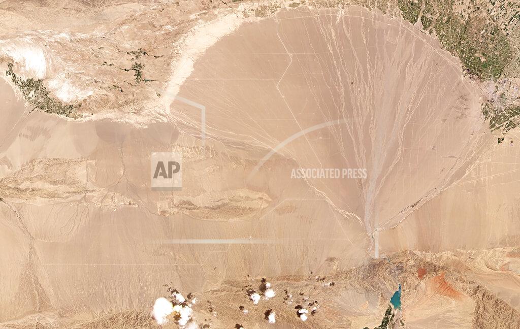 Planet Labs Inc. This June 4, 2021, satellite image provided by Planet Labs Inc. shows what analysts believe is a field of intercontinental ballistic missile silos near Yumen, China. The U.S. military is warning about what analysts have described as a major expansion of China's nuclear missile silo fields, at a time of heightened tension between the U.S. and China. (Planet Labs Inc. via AP)