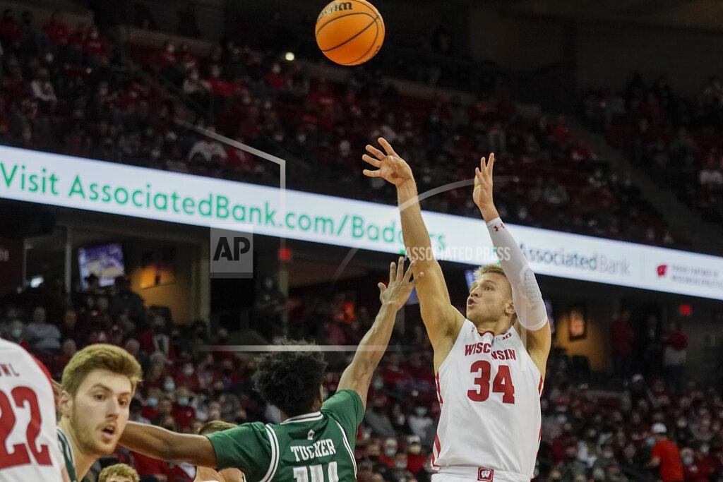 Andy Manis Wisconsin's Brad Davison (34) shoots past Green Bay's Randy Tucker (14) during the second half of an NCAA college basketball game Friday, Nov. 12, 2021, in Madison, Wis. Wisconsin won 72-34. (AP Photo/Andy Manis)