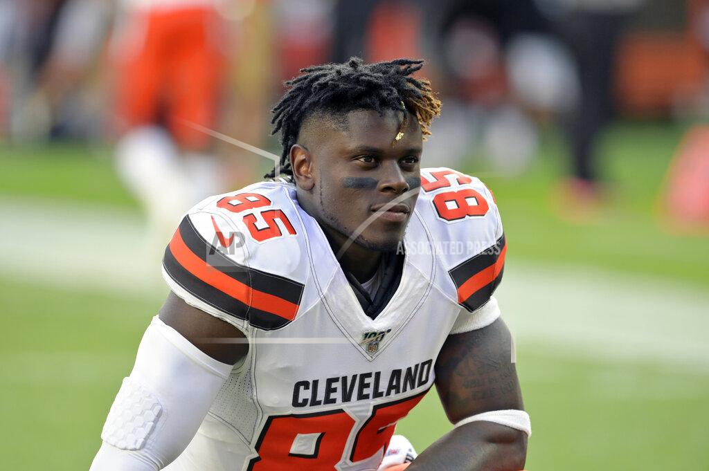 David Richard FILE - In this Aug. 8, 2019, file photo, Cleveland Browns tight end David Njoku kneels on the field before an NFL preseason football game against the Washington Redskins, in Cleveland. Njoku has returned to practice after missing eight games with a broken right wrist. Njoku was injured in Cleveland’s win over the New York Jets on Sept. 16. The Browns designated Njoku for return from injured reserve on Wednesday, Nov. 20, 2019. (AP Photo/David Richard, File)