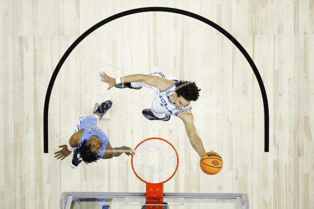 Matt Rourke UCLA's Jules Bernard, right, goes up for a shot against North Carolina's Caleb Love during the first half of a college basketball game in the Sweet 16 round of the NCAA tournament, Friday, March 25, 2022, in Philadelphia. (AP Photo/Matt Rourke)