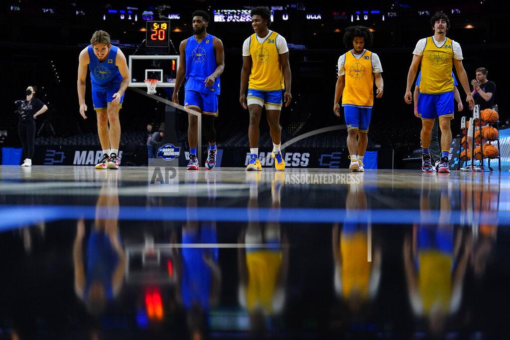 Matt Rourke UCLA players stretch during practice for the NCAA men's college basketball tournament, Thursday, March 24, 2022, in Philadelphia. (AP Photo/Matt Rourke)