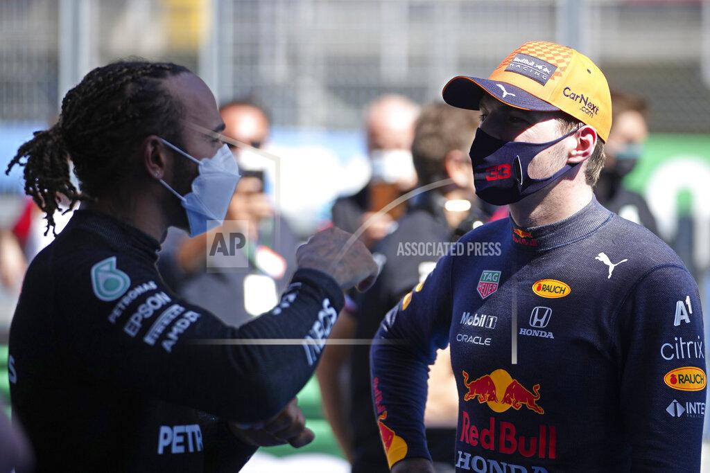 Emilio Morenatti Mercedes driver Lewis Hamilton of Britain, left, talks with Red Bull driver Max Verstappen of the Netherlands after clocking the fastest time in the qualifying for the Spanish Formula One Grand Prix at the Barcelona Catalunya racetrack in Montmelo, just outside Barcelona, Spain, Saturday, May 8, 2021. The Spanish Grand Prix will be held on Sunday. Verstappen clocked the second fastest time. (AP Photo/Emilio Morenatti, Pool)