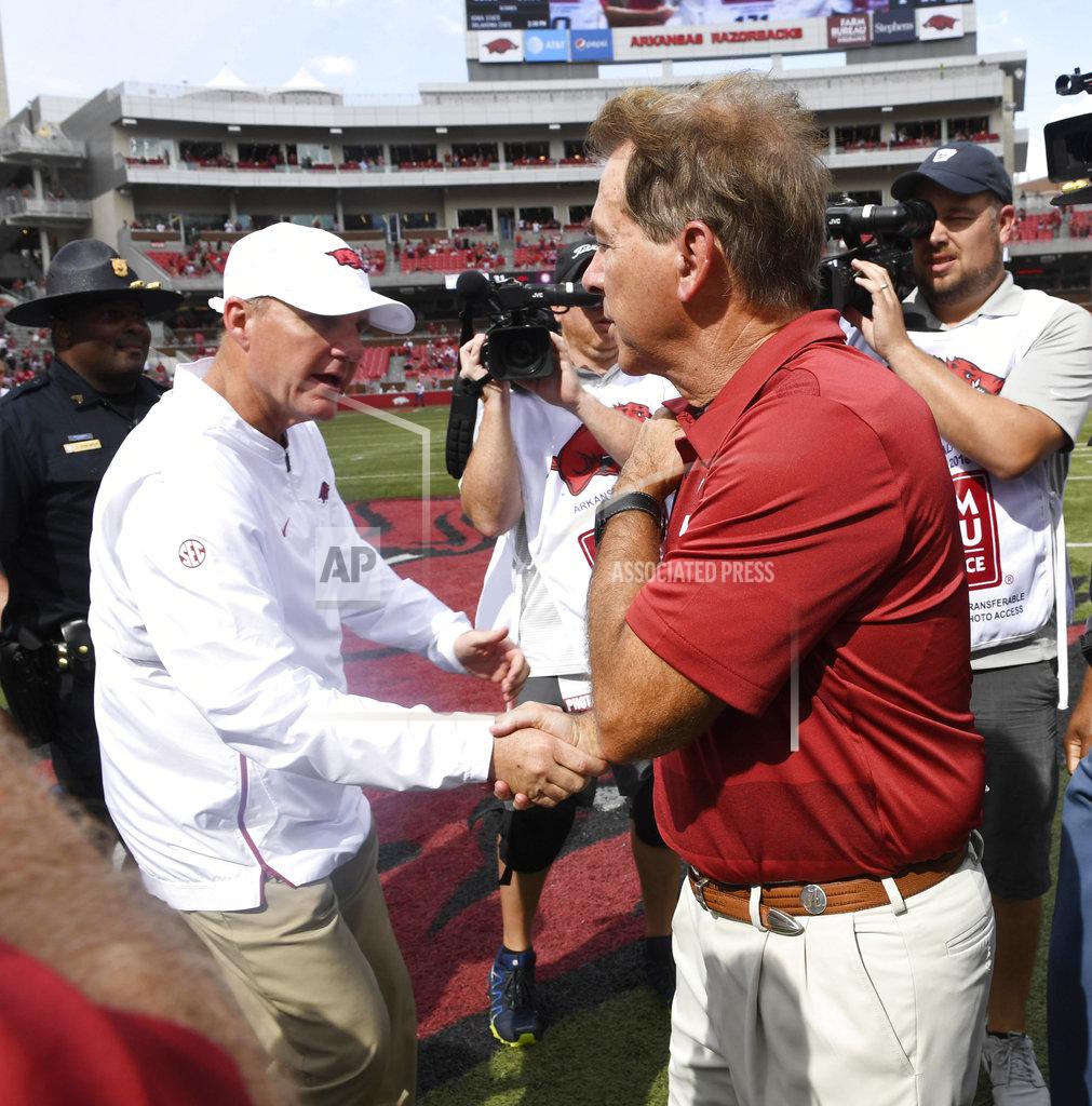 Michael Woods Alabama coach Nick Saban, right, shakes hands with Arkansas coach Chad Morris after Alabama's 65-31 win in an NCAA college football game Saturday, Oct. 6, 2018, in Fayetteville, Ark. (AP Photo/Michael Woods)