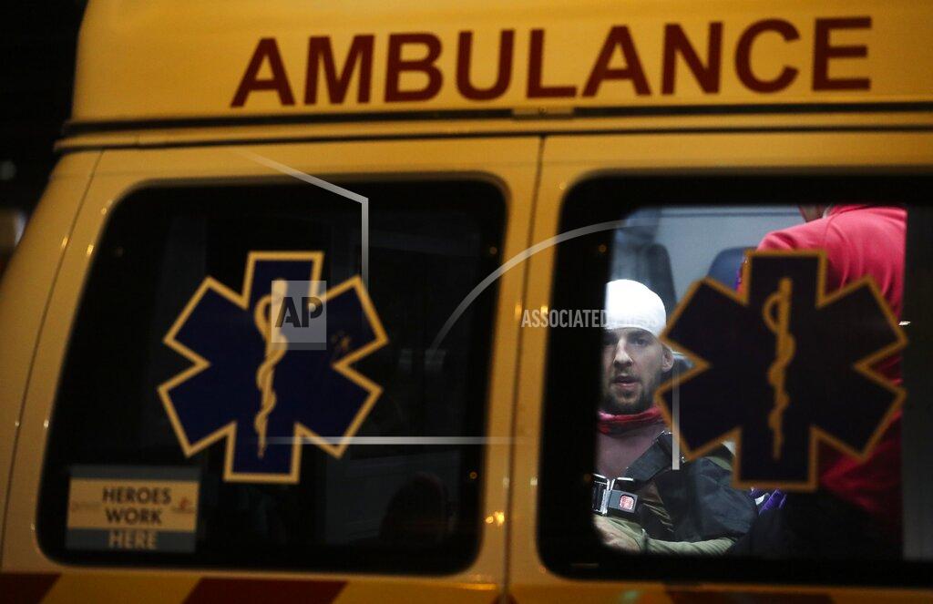 Jordon Coury, 24, gets medical attention in the back of the ambulance after he was struck in the back of the head with a rubber bullet as protesters and police faced off in downtown Tampa, Fla., Sunday, May 31, 2020. (Dirk Shadd/Tampa Bay Times via AP)