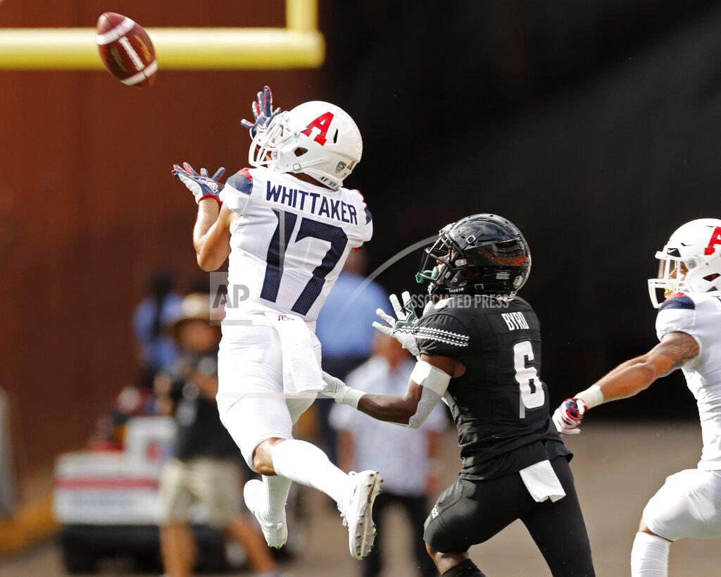 Marco Garcia Arizona cornerback Jace Whittaker (17) makes an interception in front of Hawaii wide receiver Cedric Byrd II (6) during the first quarter of an NCAA college football game Saturday, Aug. 24, 2019, in Honolulu. (AP Photo/Marco Garcia)