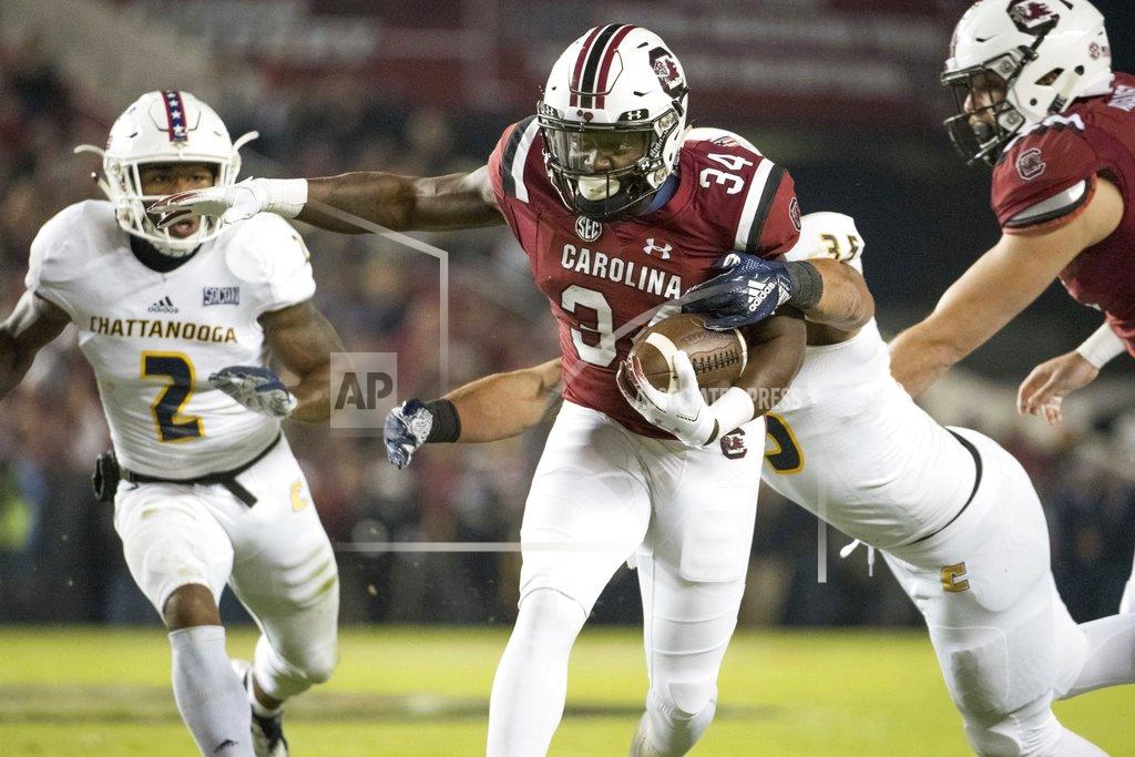 Sean Rayford South Carolina running back Mon Denson (34) carries the ball against Chattanooga linebacker Michael Bean (35) during the first half of an NCAA college football game Saturday, Nov. 17, 2018, in Columbia, S.C. (AP Photo/Sean Rayford)