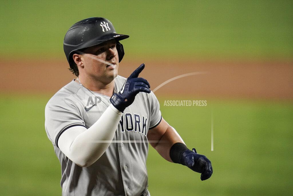 Julio Cortez New York Yankees' Luke Voit gestures while running the bases after hitting a solo home run off Baltimore Orioles starting pitcher Alexander Wells during the third inning of a baseball game, Tuesday, Sept. 14, 2021, in Baltimore. (AP Photo/Julio Cortez)