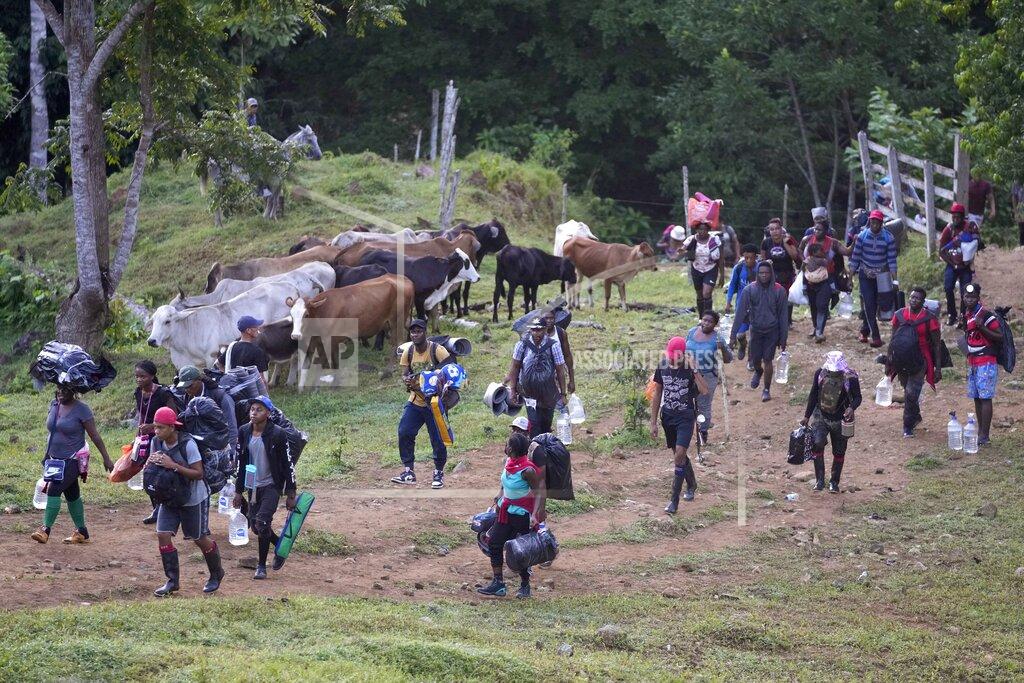 Fernando Vergara Haitian migrants continue their trek north, in Acandi, Colombia, Wednesday, Sept. 15, 2021. The migrants, following a well-beaten, multi-nation journey towards the U.S., will continue their journey through the jungle known as the Darien Gap. (AP Photo/Fernando Vergara)