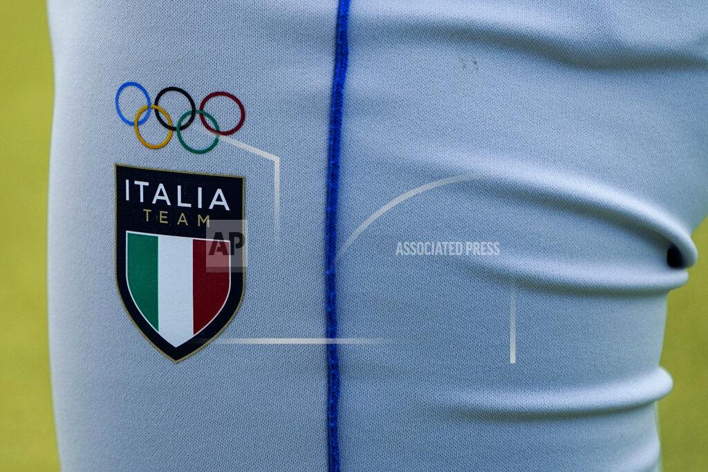 Jae C. Hong The Olympic Rings are printed on the uniform of an Italian softball player during a training session at the Fukushima Azuma Baseball Stadium ahead of the 2020 Summer Olympics, Tuesday, July 20, 2021, in Fukushima, Japan. (AP Photo/Jae C. Hong)