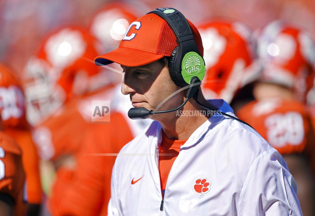 Richard Shiro FILE - In this Nov. 3, 2018, file photo, Clemson head coach Dabo Swinney walks the sidelines during the first half of an NCAA college football game against Louisville in Clemson, S.C. There’s little question where No. 2 Clemson has a clear edge on Notre Dame: It’s playoff experience. The undefeated Tigers are in their fourth straight College Football Playoff while the unbeaten Fighting Irish are in the final four for the first time. (AP Photo/Richard Shiro, File)