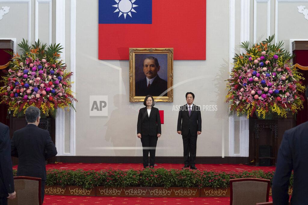 Uncredited In this photo released by the Taiwan Presidential Office, Taiwanese President Tsai Ing-wen, center stands with Vice-President Lai Ching-te during an inauguration ceremony at the Presidential office in Taipei, Taiwan, Wednesday, May 20, 2020. Tsai was inaugurated for a second term amid increasing pressure from China on the self-governing island democracy it claims as its own territory. (Taiwan Presidential Office via AP)