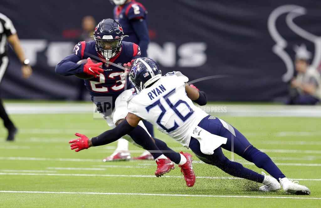 Michael Wyke Houston Texans running back Carlos Hyde (23) rushes for a gain as Tennessee Titans cornerback Logan Ryan (26) reaches to tackle him during the first half of an NFL football game Sunday, Dec. 29, 2019, in Houston. (AP Photo/Michael Wyke)
