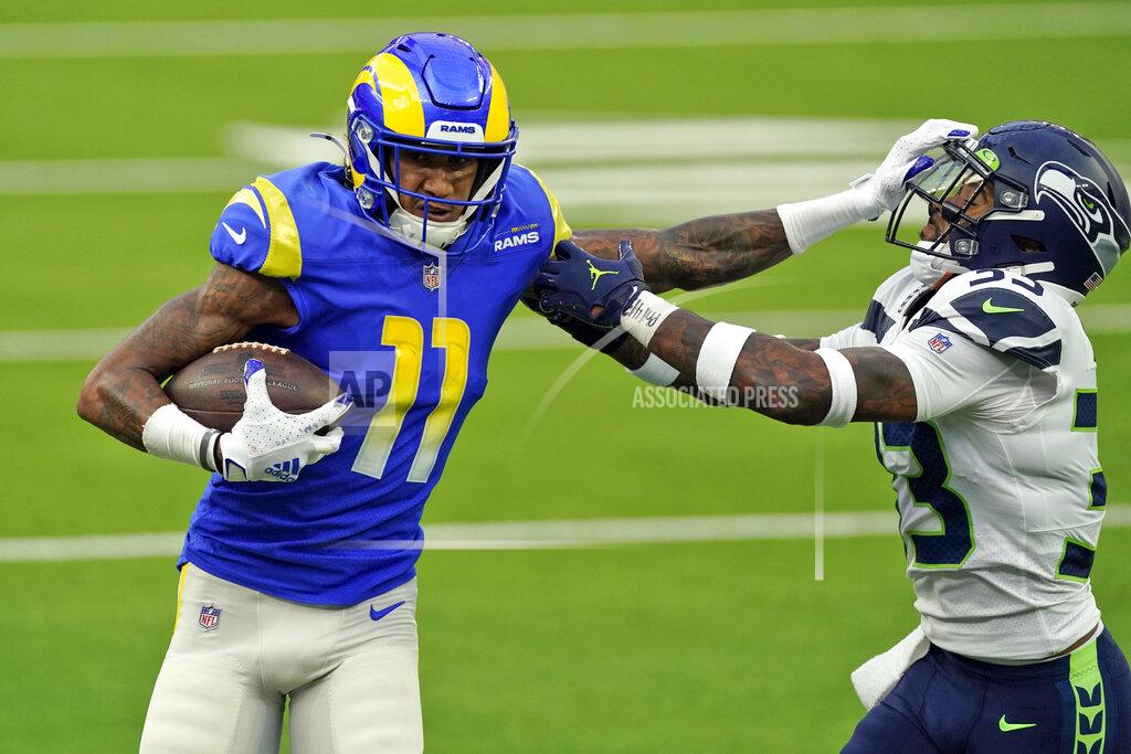 Ashley Landis FILE - Los Angeles Rams wide receiver Josh Reynolds (11) stiff-arms Seattle Seahawks strong safety Jamal Adams during the first half of an NFL football game in Inglewood, Calif., in this Sunday, Nov. 15, 2020, file photo. The Tennessee Titans have agreed to terms on a one-year deal with wide receiver Josh Reynolds. The Titans announced the deal Tuesday, March 23, 2021. (AP Photo/Ashley Landis, File)