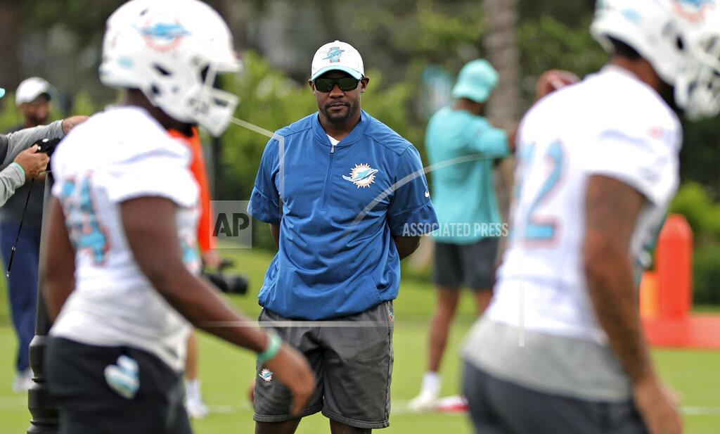 David Santiago Miami Dolphins head coach Brian Flores looks on during practice at Baptist Health Training Complex in Hard Rock Stadium on Wednesday, Oct. 13, 2021 in Miami Gardens, Florida, in preparation for their game against the Jacksonville Jaguars at Tottenham Hotspur Stadium in London on Sunday, October 17. (David Santiago/Miami Herald via AP)