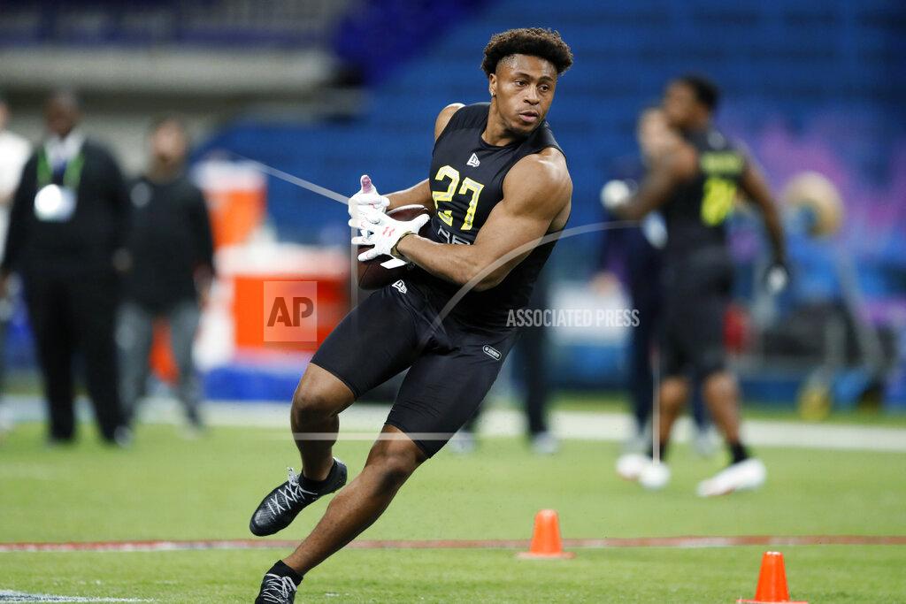 Charlie Neibergall Wisconsin running back Jonathan Taylor runs a drill at the NFL football scouting combine in Indianapolis on Friday, Feb. 28, 2020. (AP Photo/Charlie Neibergall)