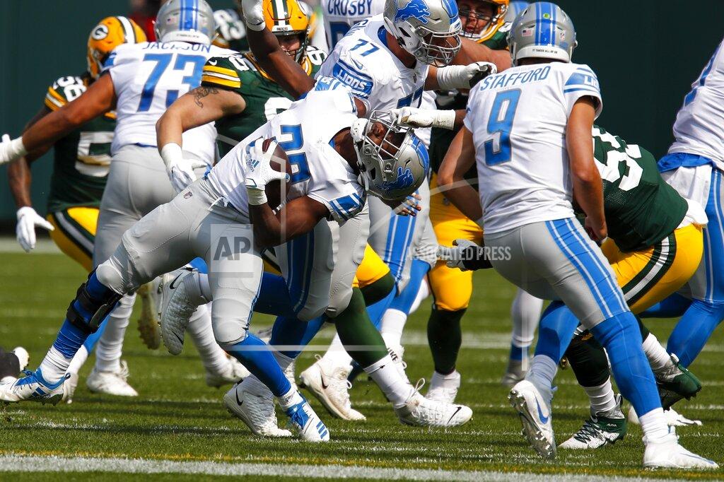 Matt Ludtke Green Bay Packers' Za'Darius Smith is called for a facemask penalty on Detroit Lions' Kerryon Johnson during the first half of an NFL football game Sunday, Sept. 20, 2020, in Green Bay, Wis. (AP Photo/Matt Ludtke)