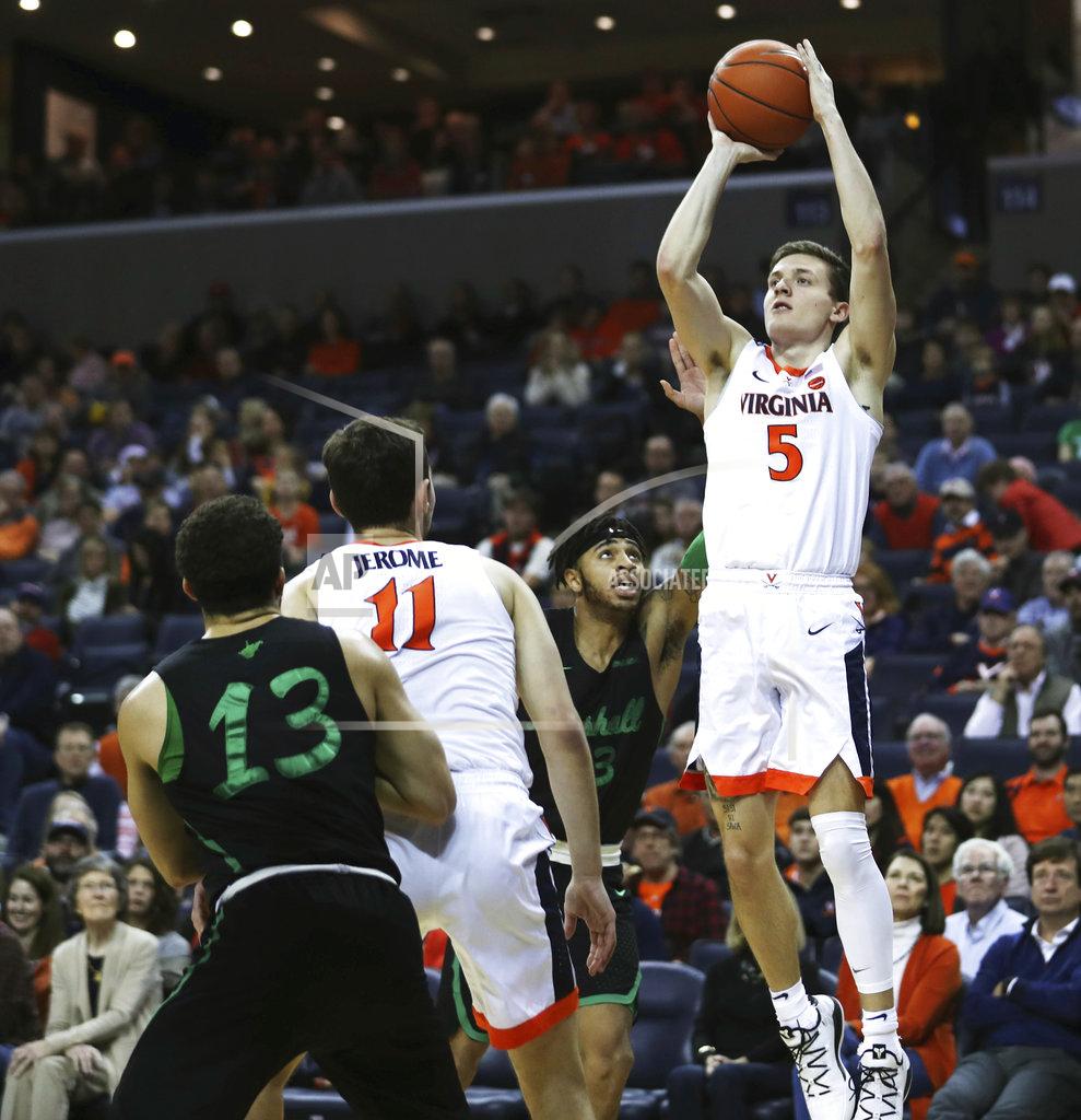 Zack Wajsgras Virginia's guard Kyle Guy (5) shoots over two Marshall defenders in the first half of an NCAA college basketball game on Monday, Dec. 31, 2018, in Charlottesville, Va. (AP Photo/Zack Wajsgras)