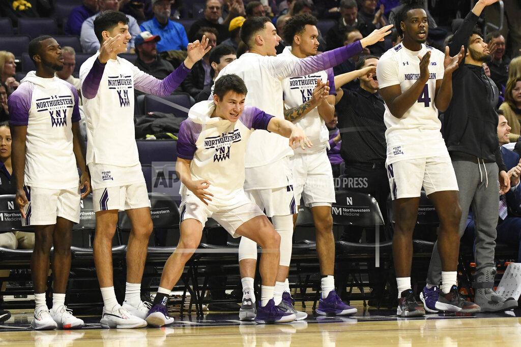 David Banks The Northwestern bench celebrates a 3-point basket against Iowa during the first half of an NCAA college basketball game Tuesday, Jan. 14, 2020, in Evanston, Ill. (AP Photo/David Banks)