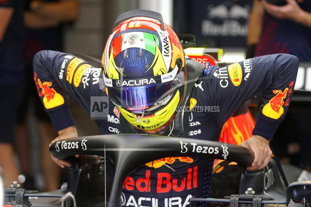 Darron Cummings Red Bull driver Sergio Perez, of Mexico, climbs into his car during a practice session for the Formula One U.S. Grand Prix auto race at the Circuit of the Americas, Saturday, Oct. 23, 2021, in Austin, Texas. (AP Photo/Darron Cummings)