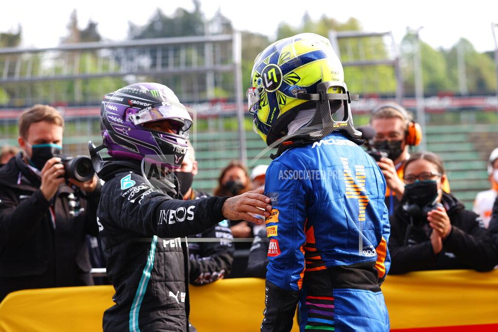 Bryn Lennon Third placed McLaren's Lando Norris, right, is greeted by second placed Mercedes' Lewis Hamilton at the end of the Emilia Romagna Formula One Grand Prix, at the Imola racetrack, Italy, Sunday, April 18, 2021. (Bryn Lennon/ Pool Via AP)