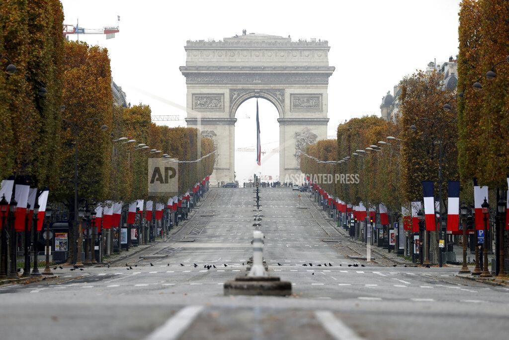 Christian Hartmann The empty Champs Elysees avenue is seen during the Armistice Day ceremonies marking the end of World War I, in Paris, Wednesday, Nov. 11, 2020. French President Emmanuel Macron is commemorating the 102nd anniversary of the armistice ending World War I and honoring all those who have died for France in two elaborate, solemn ceremonies Wednesday. (Christian Hartmann/Pool via AP)