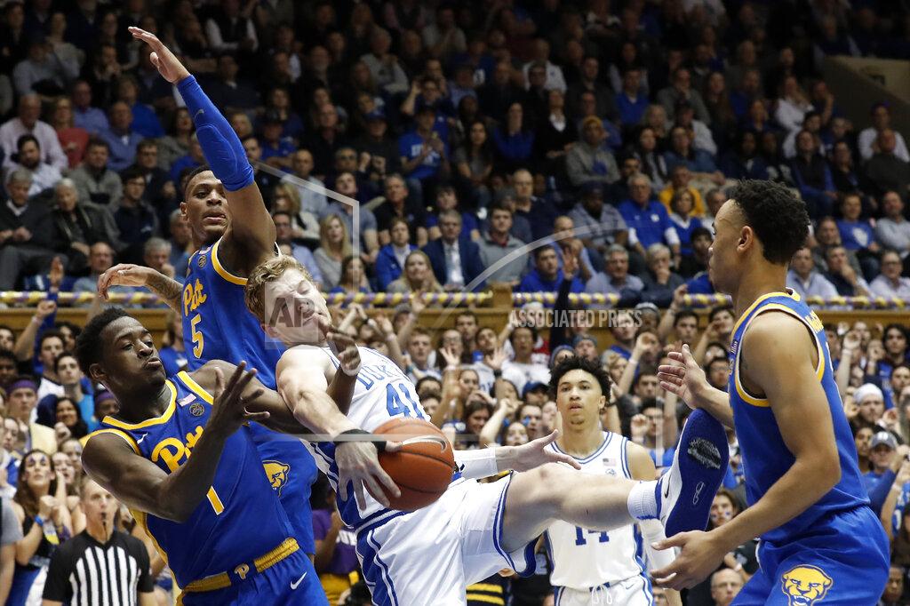 Gerry Broome Duke forward Jack White (41) struggles for a rebound with Pittsburgh guard Xavier Johnson (1) and guard Au'Diese Toney (5) during the second half of an NCAA college basketball game in Durham, N.C., Tuesday, Jan. 28, 2020. (AP Photo/Gerry Broome)