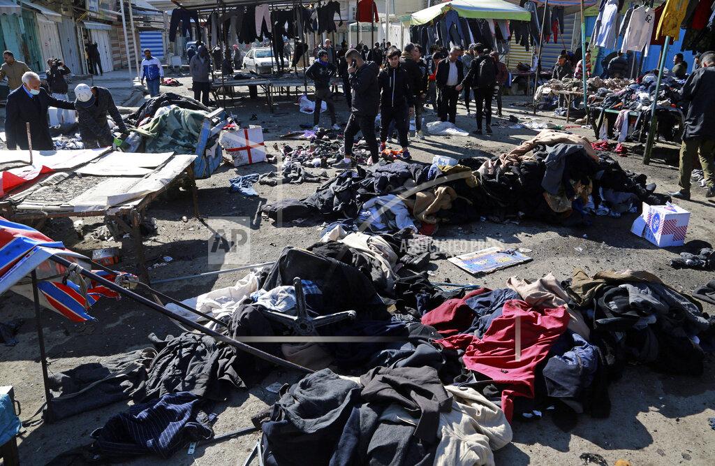 Hadi Mizban Security forces work at the site of a deadly bomb attack in Baghdad, Iraq, Thursday, Jan. 21, 2021. Iraq's military said twin suicide bombings at the Bab al-Sharqi commercial area in central Baghdad Thursday ripped through the busy market killing over two dozen and wounding over 70, with some in serious condition. (AP Photo/Hadi Mizban)